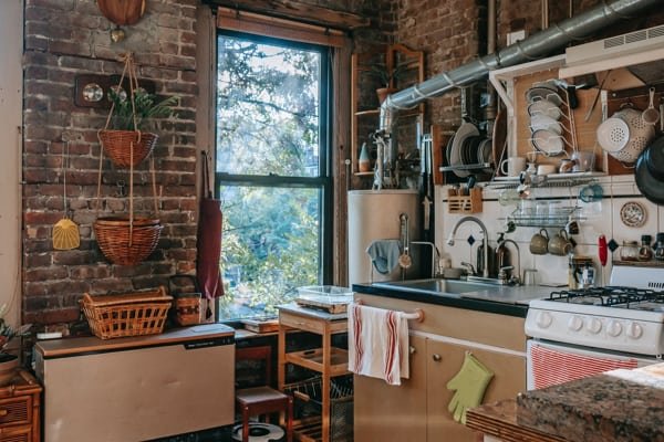 Good lighting can even make a messy kitchen look charming