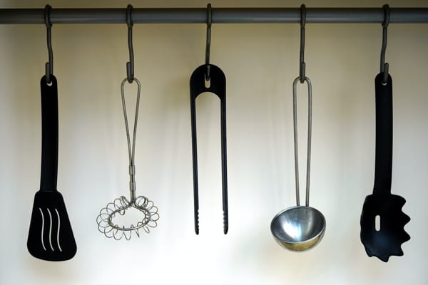 Hang your most used kitchen utensils close to the stove or sink