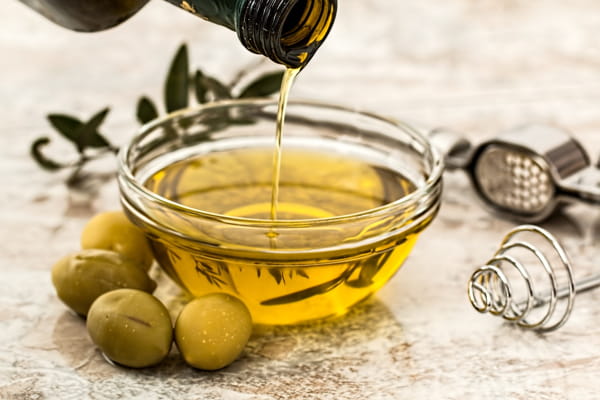 Olive oil is only suitable for seasoning cast iron cookware if you cook daily